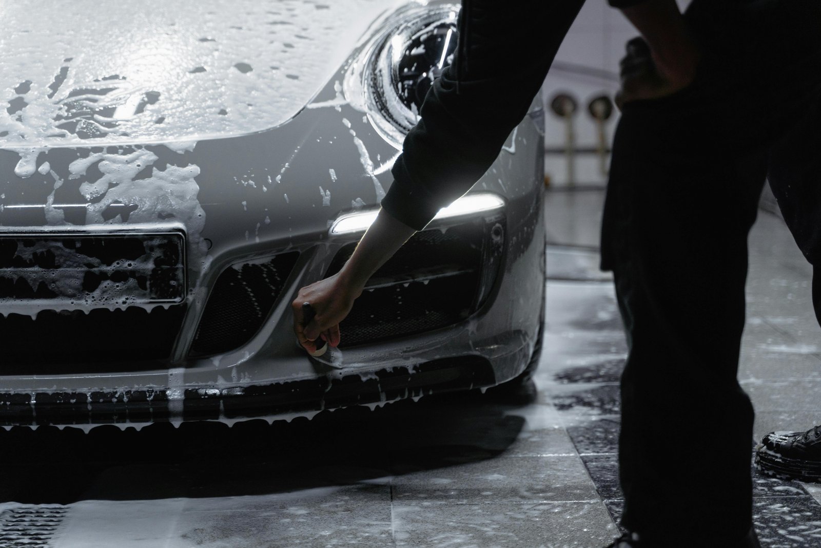 Luxury vehicle side profile with mirror-finish paint after detailing